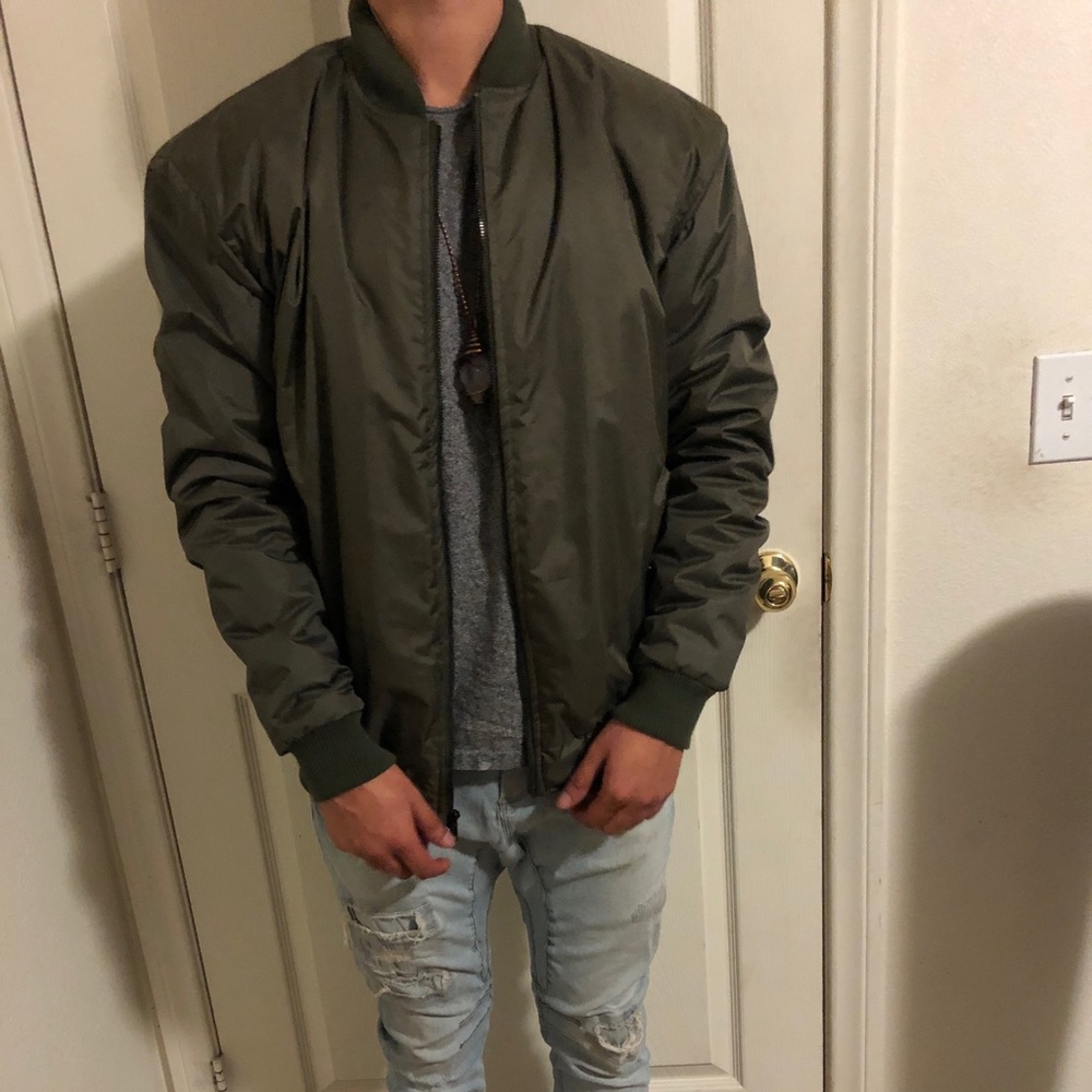 Dark green bomber jacket.